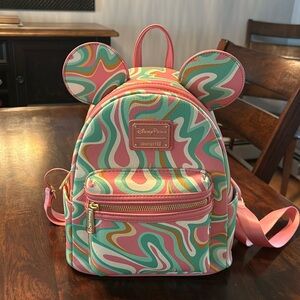 DisneyParks Green/Pink swirl Loungefly backpack